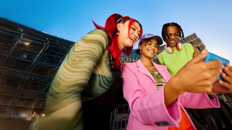 three people taking a photo together