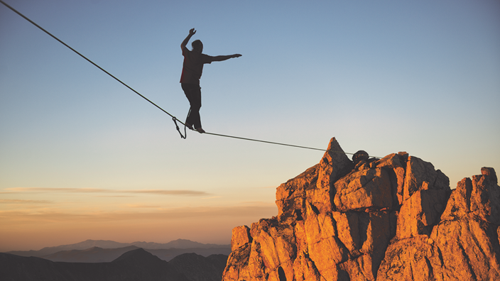 Tightrope walker on mountain