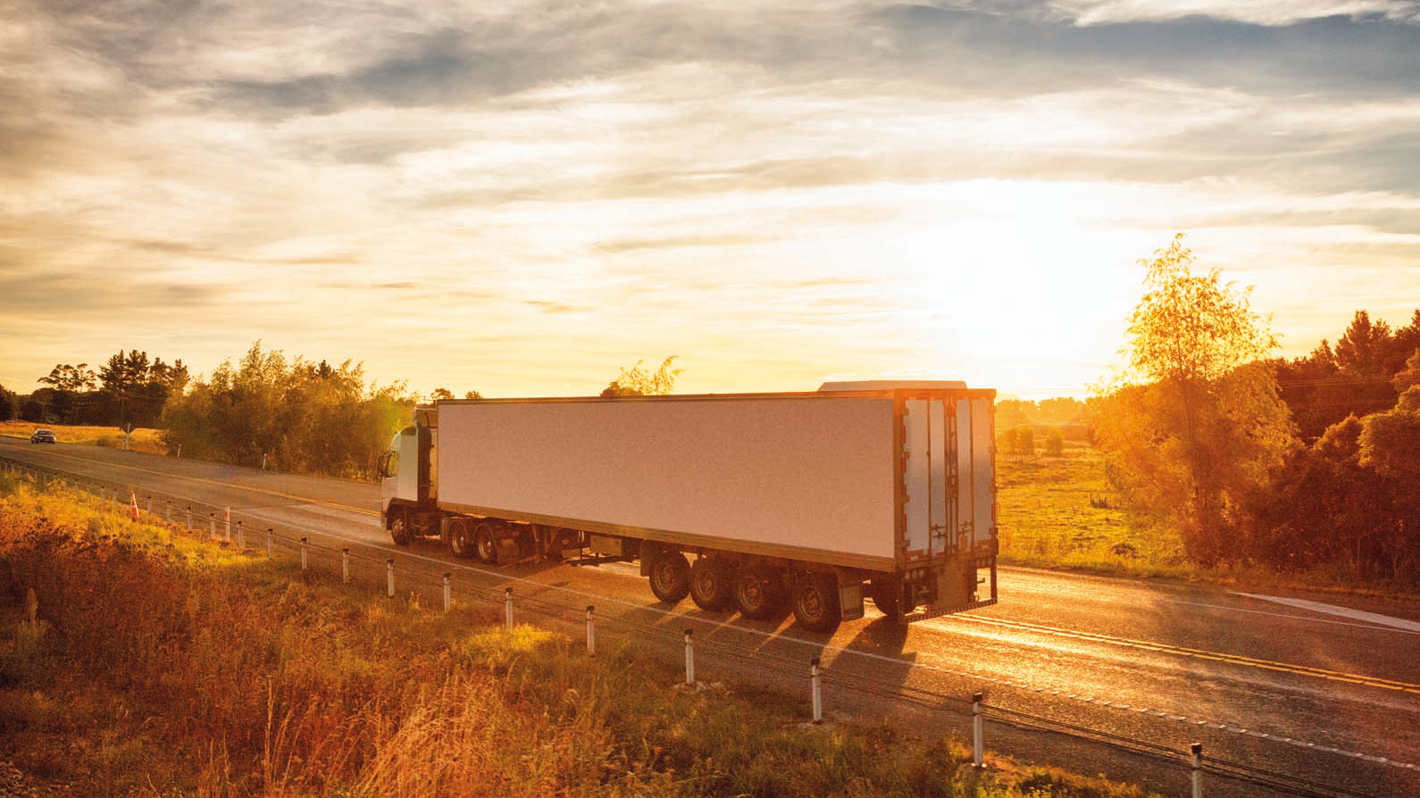 truck lorry driving through rural countryside
