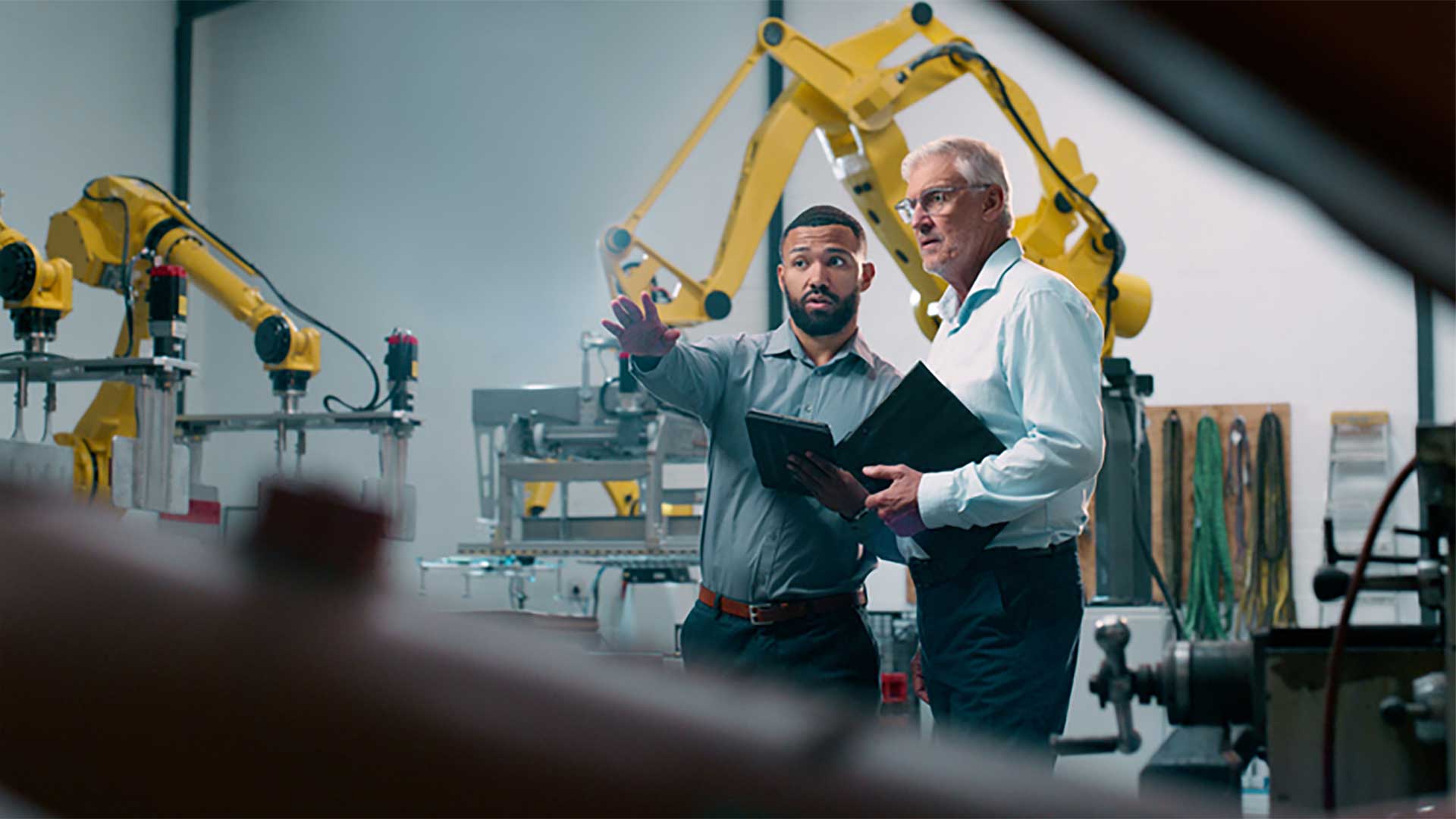 Two engineers assessing the machines