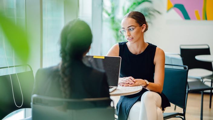 two ladies in a meeting