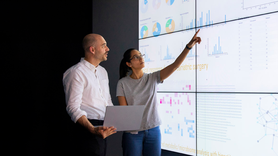 two people looking at a report