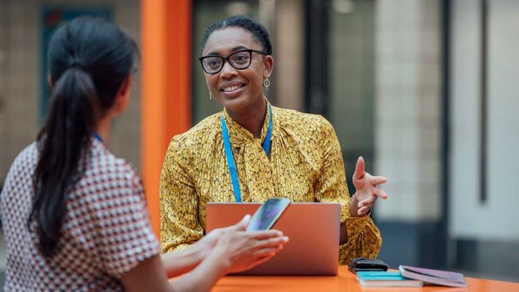 Two teachers in conversation at school