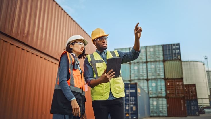 Two workers in shipping dock
