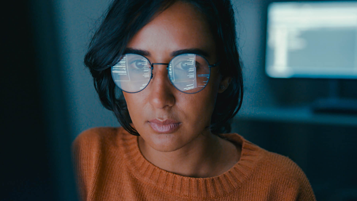 woman coding on computer