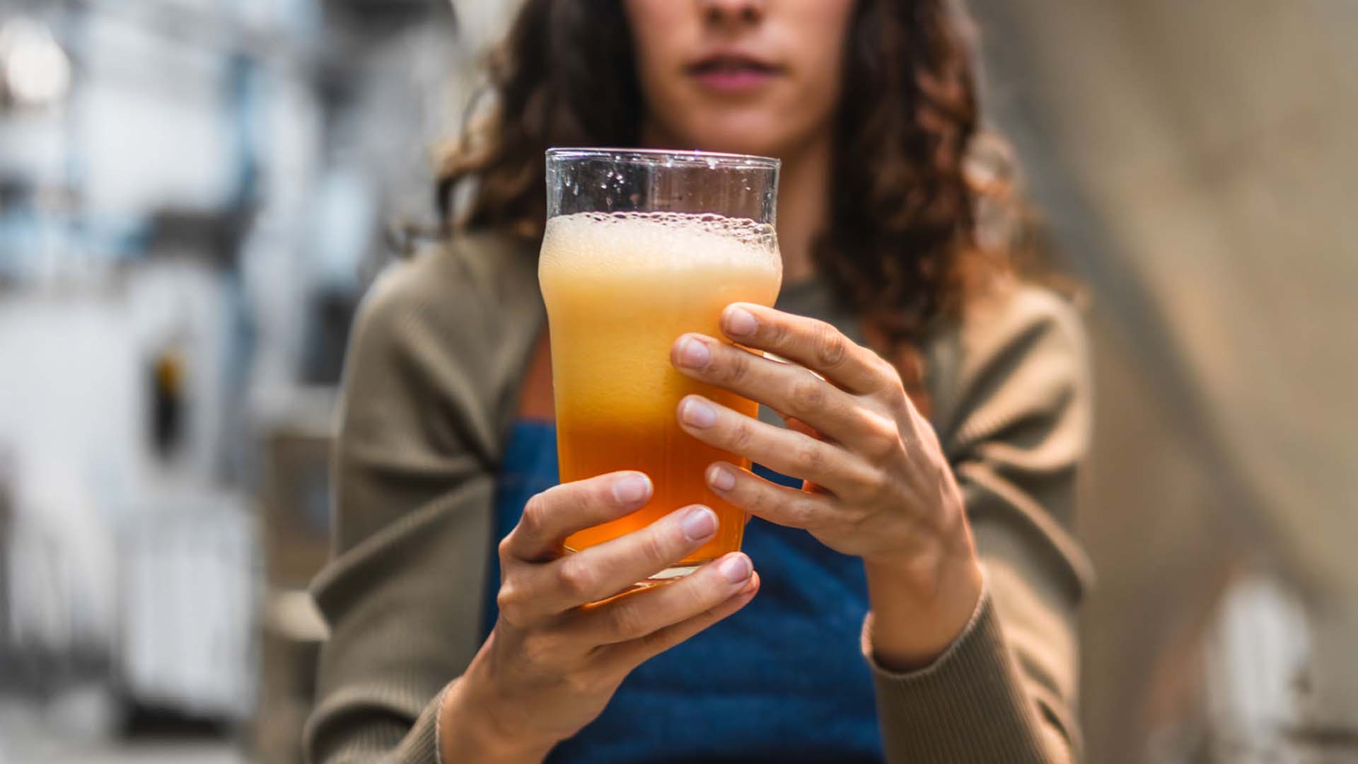 Woman holding beer glass