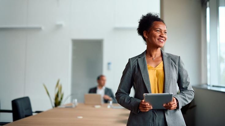 Woman holding ipad in meeting room