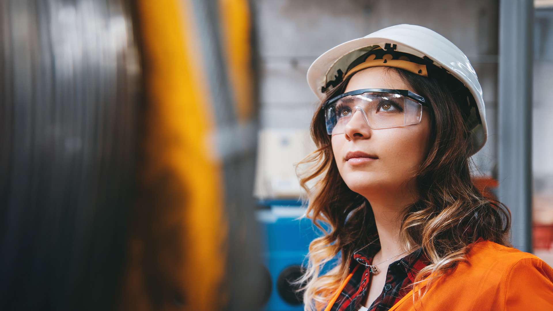 Woman in hardhat and goggles