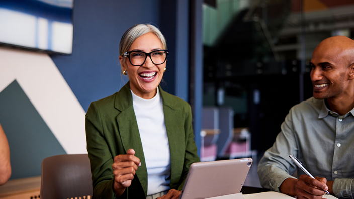 woman laughing at desk