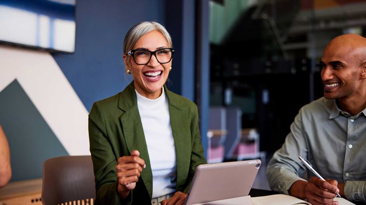 woman-laughing-in-a-meeting