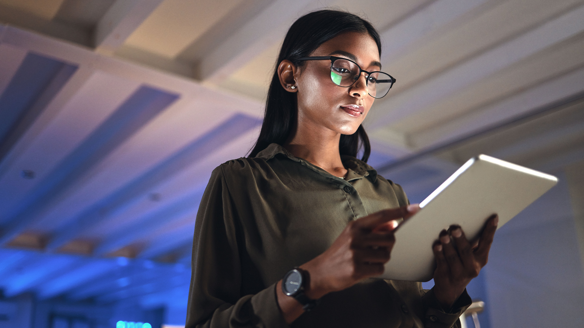 woman looking at tablet