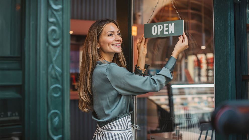 woman opening shop