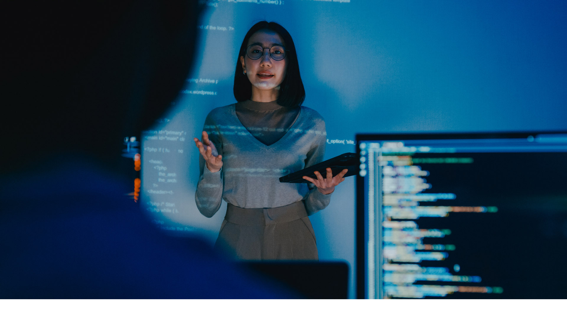 woman presenting about ai and computer code