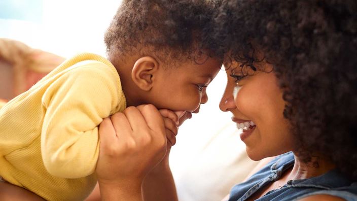 woman-smiling-at-baby