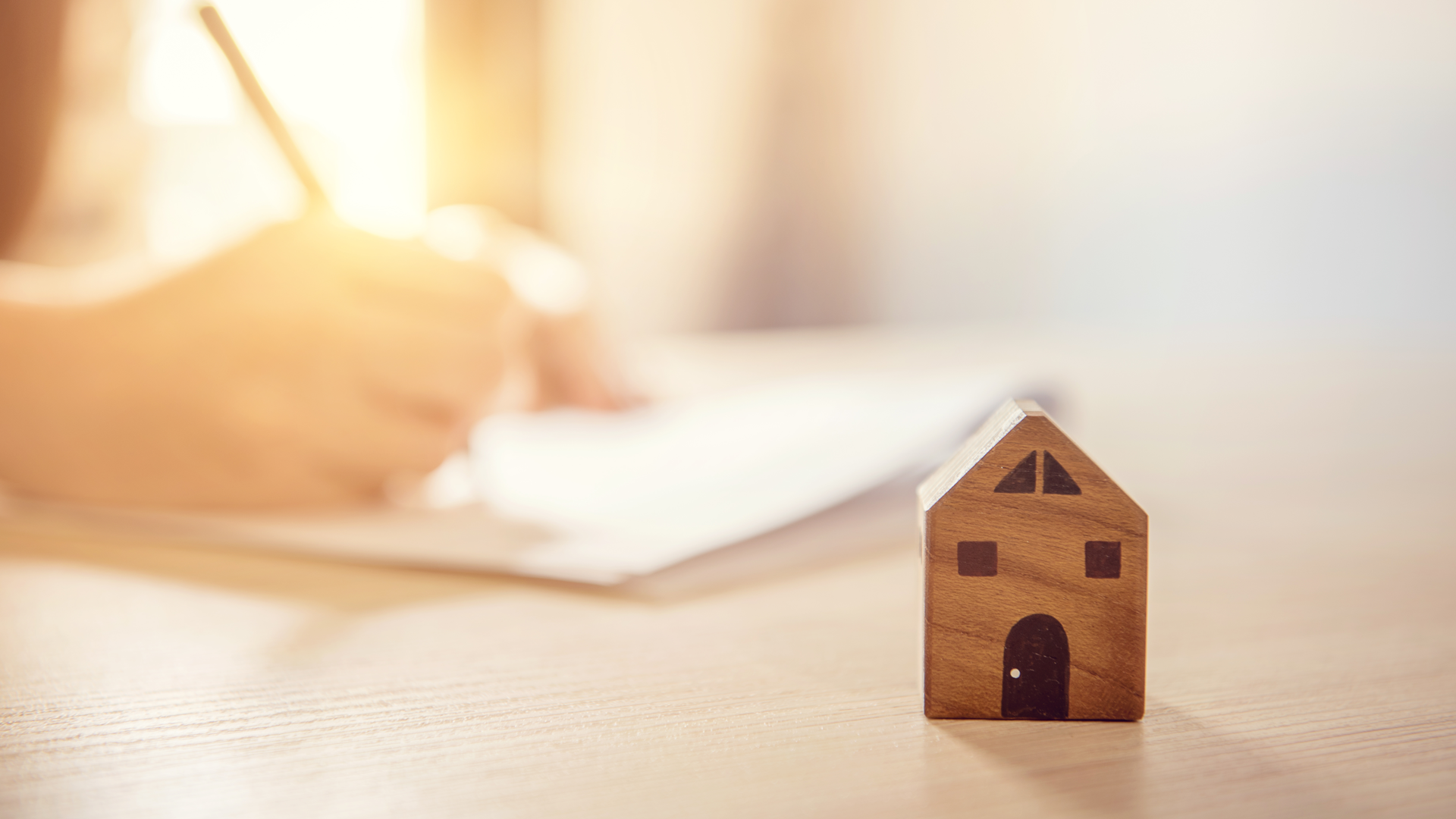 Wooden house on desk