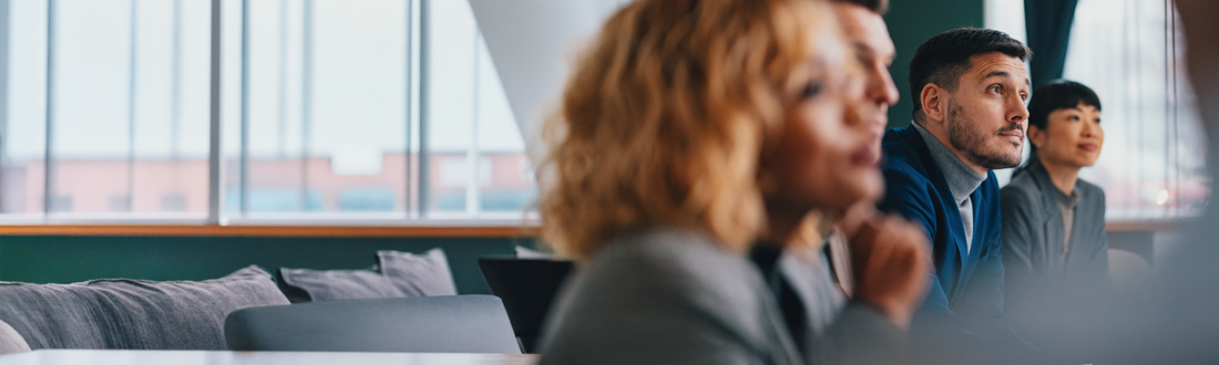 close up of a man at a meeting