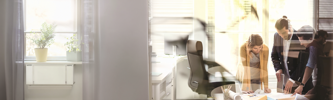 people in a business meeting looking at paperwork