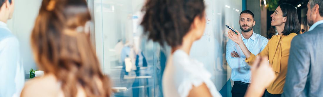 People looking at a board
