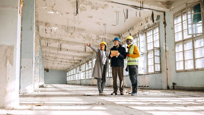 Surveyors inspecting office space