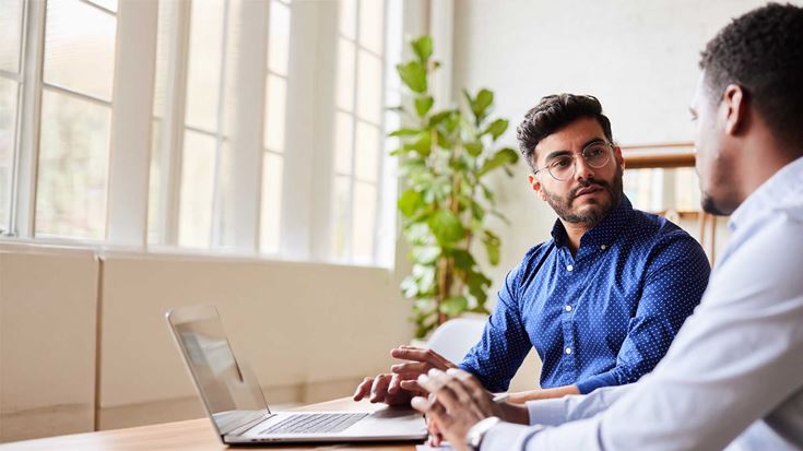 Two professional men in a meeting