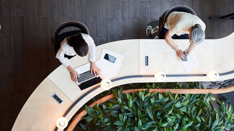 Two professionals working at a desk