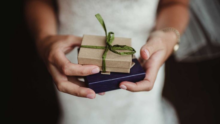 Woman--holding-wrapped-present