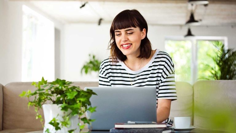 A woman on a video call smiling