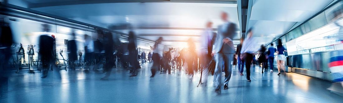 People walking through an airport