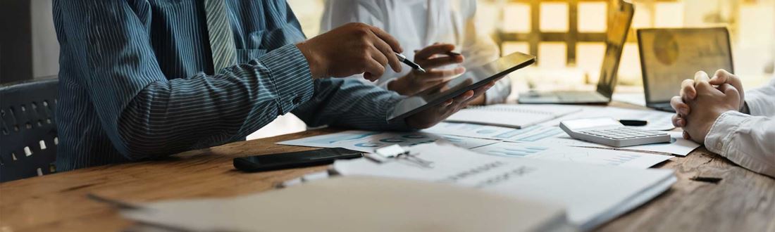 three-people-working-on-data