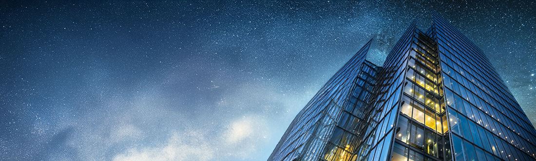 View of an office skyscraper with the night sky
