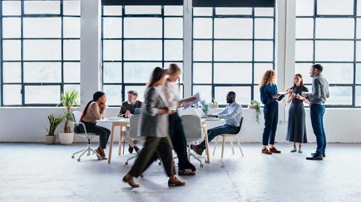 Group-of-office-workers-in-large-room
