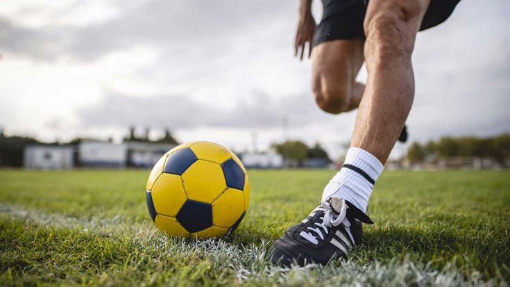 Kicking a football
