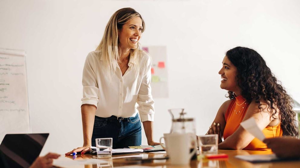 Ladies-at-desk-presenting-papers