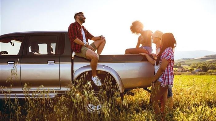 Car driving through forest
