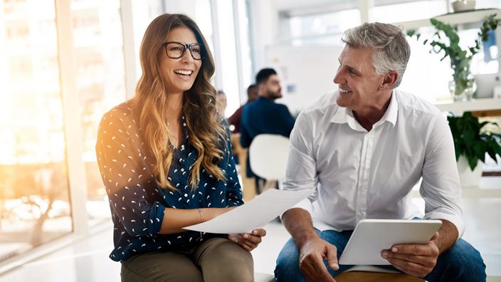 woman and man with ipad