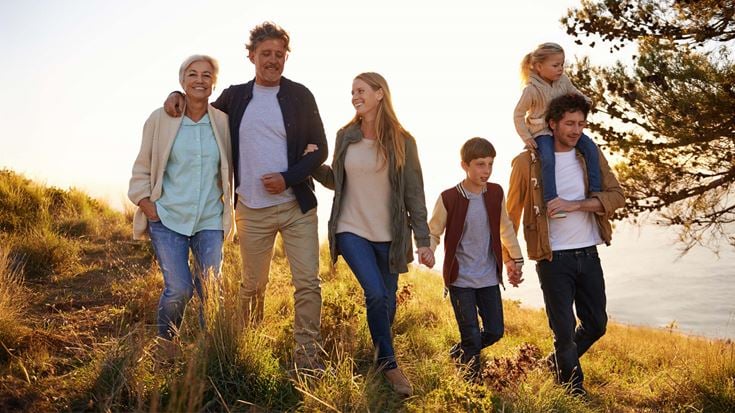 family walking through field