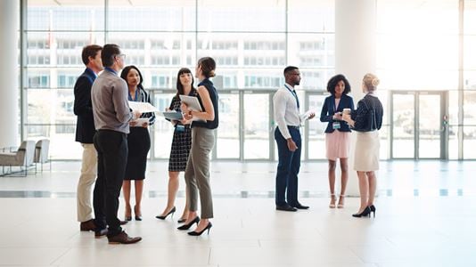 Groups of people standing in foyer