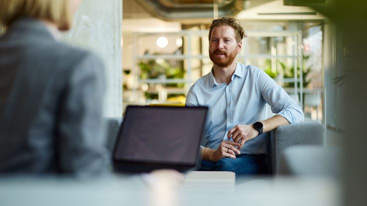 A man speaking in a meeting