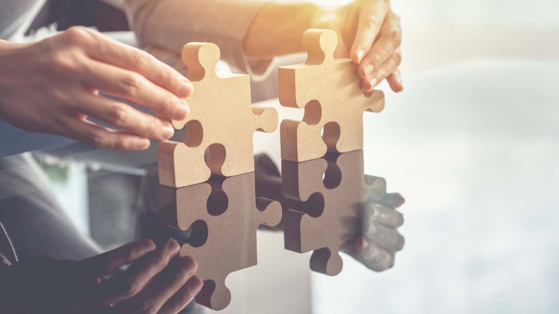 person putting puzzle pieces together