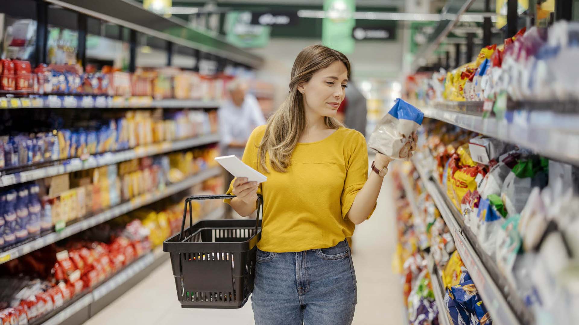 Woman in store looking at food