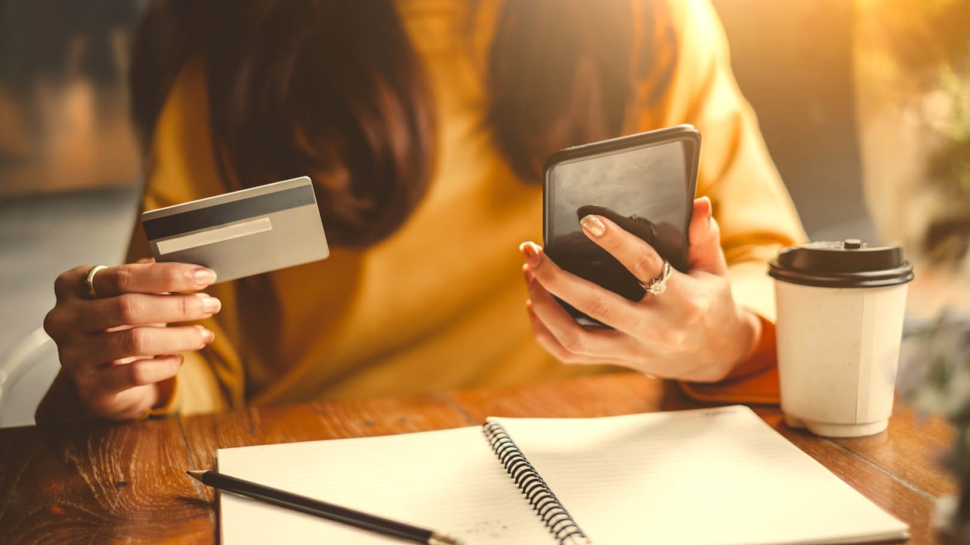 woman paying on phone