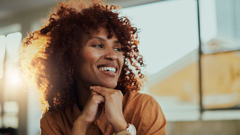 woman smiling looking to the right