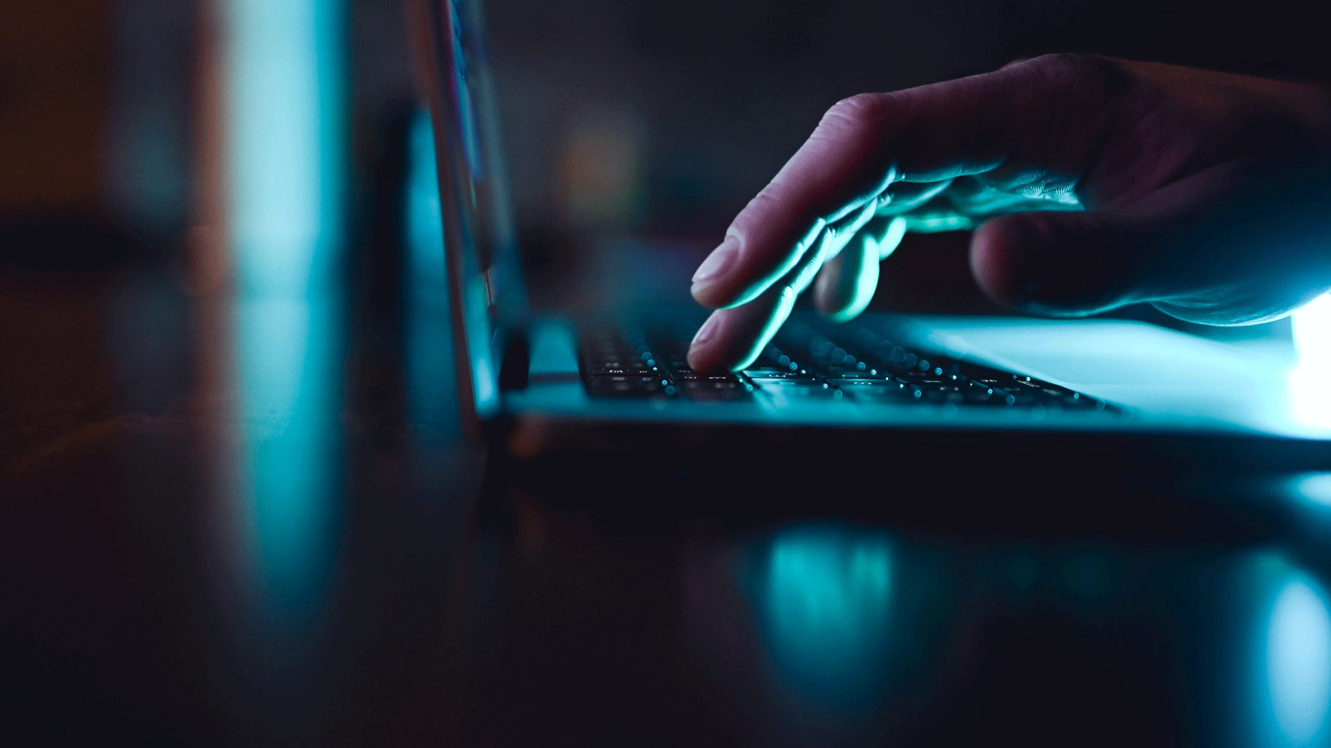 typing-on-laptop-dark-image