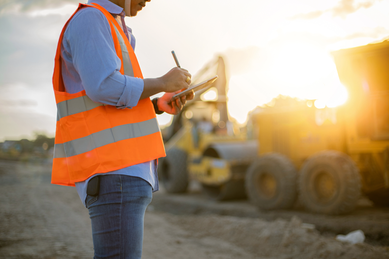 Professional inspecting industrial machinery.