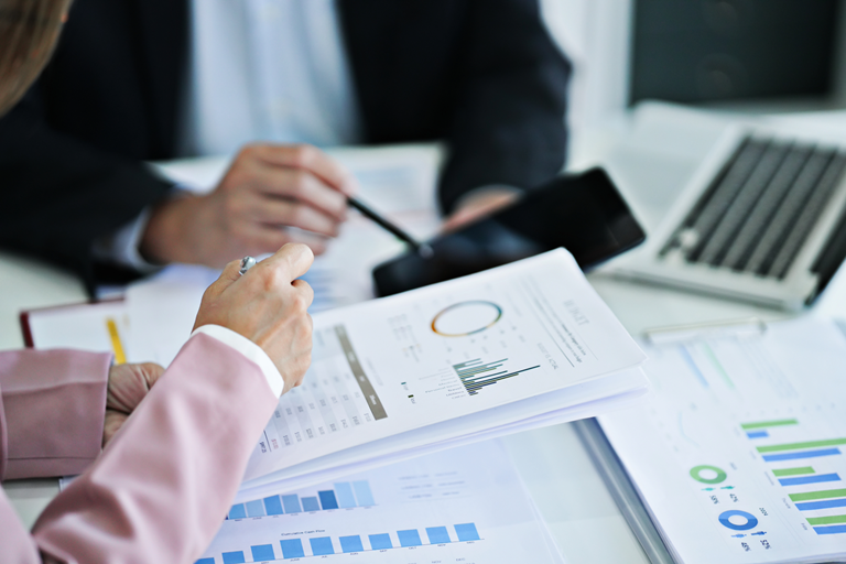 Professionals reviewing valuation assumptions and supporting records