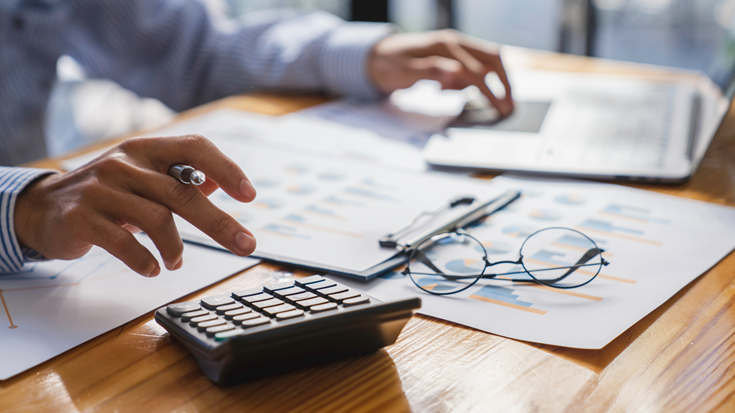 Finance director reviewing a cash forecast and repayment schedule