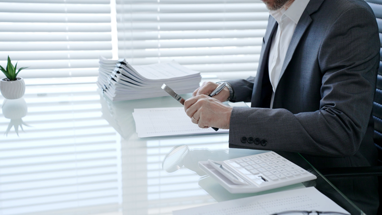 Professional examining a tax matter and supporting records