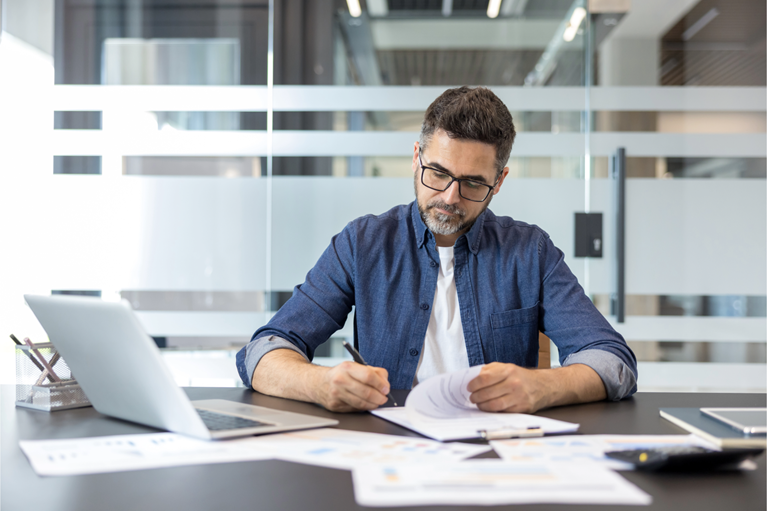 Professional reviewing a financial system report