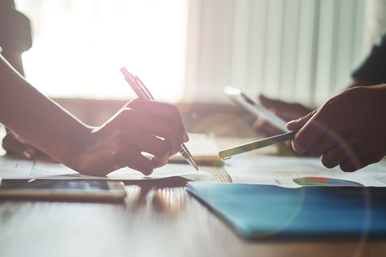 Adviser and executive reviewing transaction findings