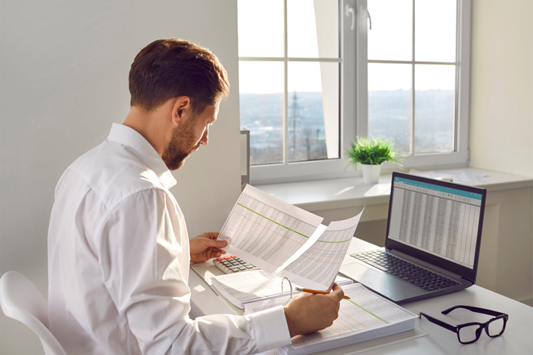 Financial accountant auditor or business man doing paperwork in the office Young corporate employee